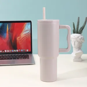 40oz stainless steel insulated vacuum tumbler with handle and straw in office desk setup