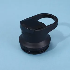 Detailed macro view of a durable black matte water bottle lid with a integrated carry handle