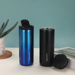 Dual blue and black stainless steel vacuum insulated coffee tumblers with lids.
