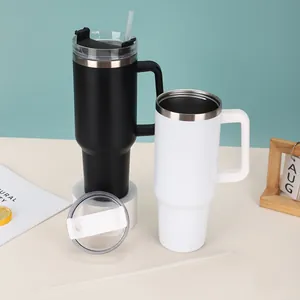 Detailed view of 40oz vacuum insulated tumblers with handles in matte black and white