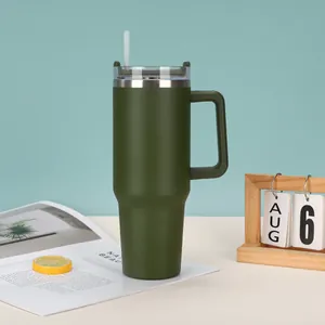 Detailed view of 40oz olive green insulated tumbler with handle and straw on desk
