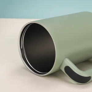 Close-up of a 40oz insulated stainless steel tumbler with a light green matte finish