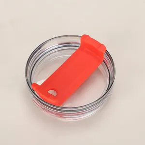 Detail view of transparent 40oz tumbler lid with bright orange sliding closure