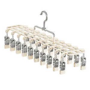 Cream colored multi-clip laundry drying rack with stainless steel clips for socks