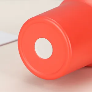 Detailed macro view showing the circular non-slip white pad on the bottom of a red 40oz tumbler