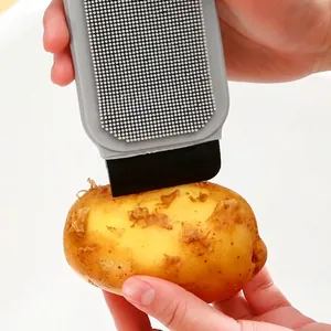 Multifunctional silicone fruit vegetable cleaning brush with scraper for potato and carrot.