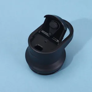 Close-up detail of a durable black flip-top lid with a carry handle for a sports water bottle