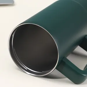 Detailed close-up of 40oz green stainless steel tumbler rim and insulated interior
