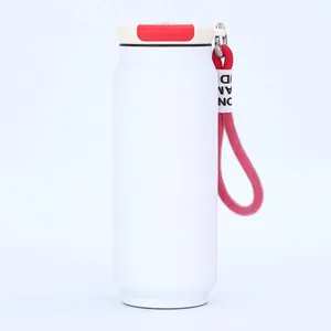 Detailed view of white soda can vacuum insulated cup with a durable red carry strap