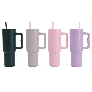 Detailed view of four colorful 40oz insulated tumblers with handles and straws.