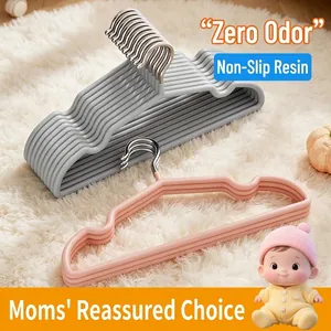Non-slip resin children's clothes hangers in pink and grey for baby clothing organization