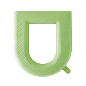 Waterproof light green U-shaped silicone toilet seat cover with textured non-slip surface