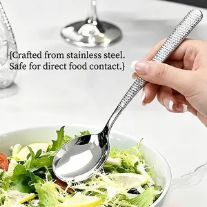 Elegant silver stainless steel dining spoon featuring a unique ice-textured long handle