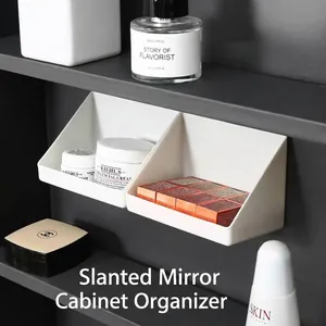 White slanted storage boxes for mirror cabinets organizing cosmetics and lipsticks