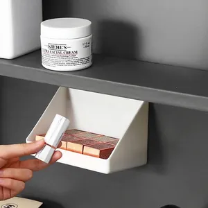 Angled plastic makeup organizer box for mirrored cabinet storage in white finish