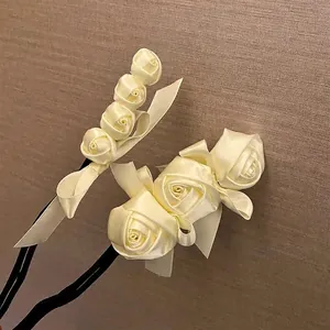 Elegant cream ribbon rose hair bun maker accessory for vintage hairstyles detail view