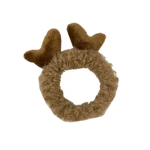 Cute brown plush hair scrunchie with reindeer antlers for winter
