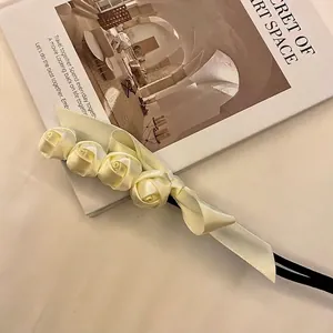 Close-up of elegant satin rose hair bun maker for vintage hairstyles