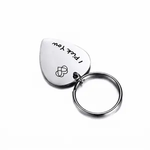 Heart-shaped stainless steel guitar pick keychain with 'I Pick You' engraving