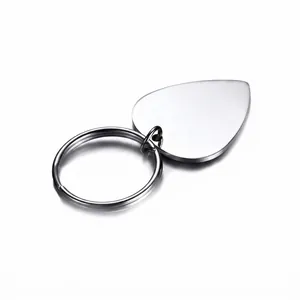 Polished stainless steel guitar pick keychain with ring on white background