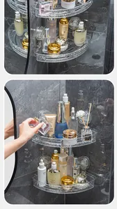 Two-tier transparent corner bathroom shelf holding skincare products on marble wall