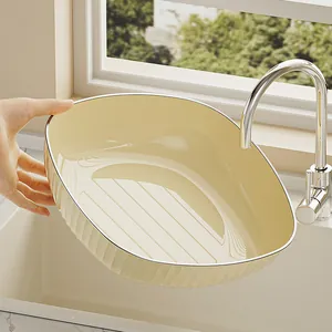 Elegant cream-colored oval fruit bowl with ribbed texture for high-end home decor