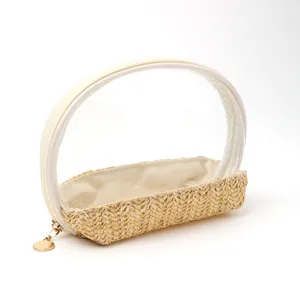 Detail showing straw-woven base and clear PVC top of a portable cosmetic bag