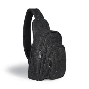 Detailed view of a stylish black glitter chest bag featuring multiple zippered pockets
