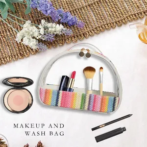 Transparent PVC makeup bag featuring a colorful rainbow woven base and gold zipper.