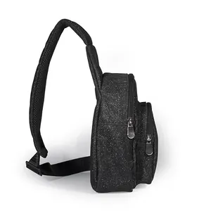 Side view of black glitter sling bag featuring dual zipper compartments and mesh strap