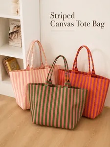 Macro view of three colorful striped canvas tote bags for women in a home scene