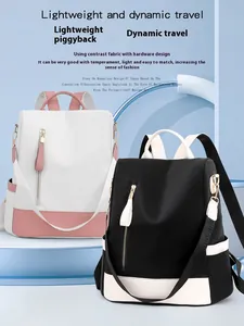 Zaini antifurto moderni da donna con design bicolore in bianco e nero alla moda