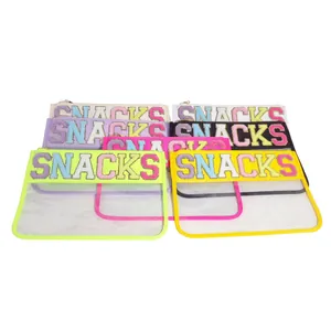 Collection of transparent PVC storage bags with colorful SNACKS chenille patches