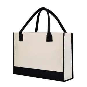 Detailed side view of a large capacity cream and black canvas shopping tote bag