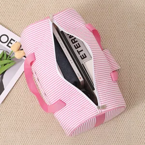 Detail view showing the large interior capacity of the pink striped bubble cotton gym bag.