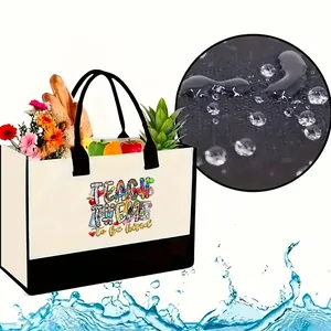 Bolso tote de lona impermeable con estampado 'Teach Them to be Kind' y detalle de agua