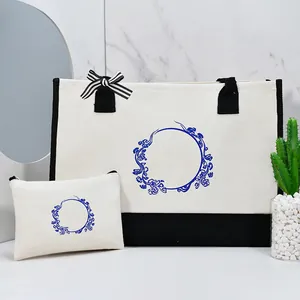 Detailed view of the large canvas tote bag and matching pouch with blue print