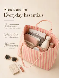 Macro detail view of a pink striped canvas tote bag showing its spacious interior capacity