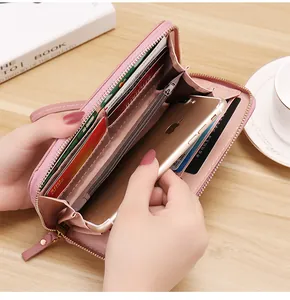 Detailed view of pink litchi grain leather wallet interior with large phone compartment