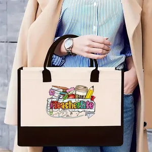 Gran bolso tote de lona con estampado gráfico colorido de TeacherLife sostenido por modelo