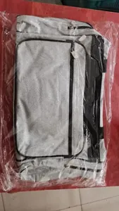 Detail of silver glitter sports travel bag stored in a transparent plastic packaging bag
