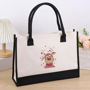 Macro view of the cute reindeer cartoon print on the durable cream canvas tote bag.