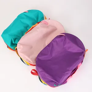 Multi-color assortment of waterproof nylon backpacks in pink, purple, and teal colors