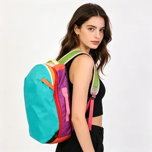Vibrant patchwork waterproof nylon travel backpack with multiple compartments on a model