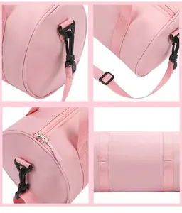 Detail view of the durable plastic hardware and stitching on a pink dance gym bag.