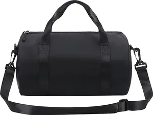 Close-up of waterproof black cylindrical gym and dance bag with shoulder strap