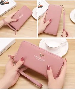 Detailed views of a pink litchi pattern long zipper clutch wallet with wrist strap