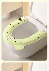 Detailaufnahme der grünen EVA-Toilettensitzauflage mit süßer Katze und Melonenprint