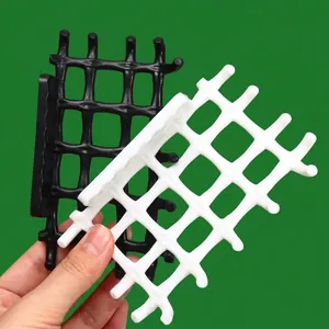 Modern wall-mounted adhesive soap dish with draining grid and multiple hanging hooks