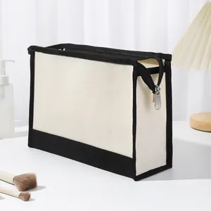 Trousse de maquillage en toile crème avec bordure noire et fermeture éclair